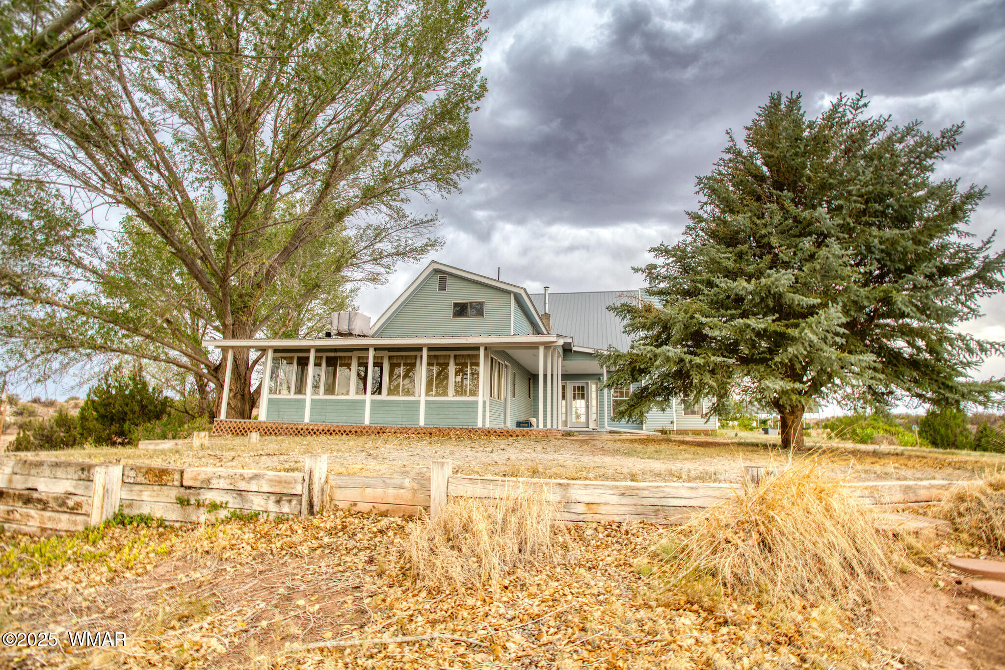 9410 Butler Trail Snowflake, AZ 85937 - Photo 6 of 62 a front view of a house with a yard covered with snow and trees