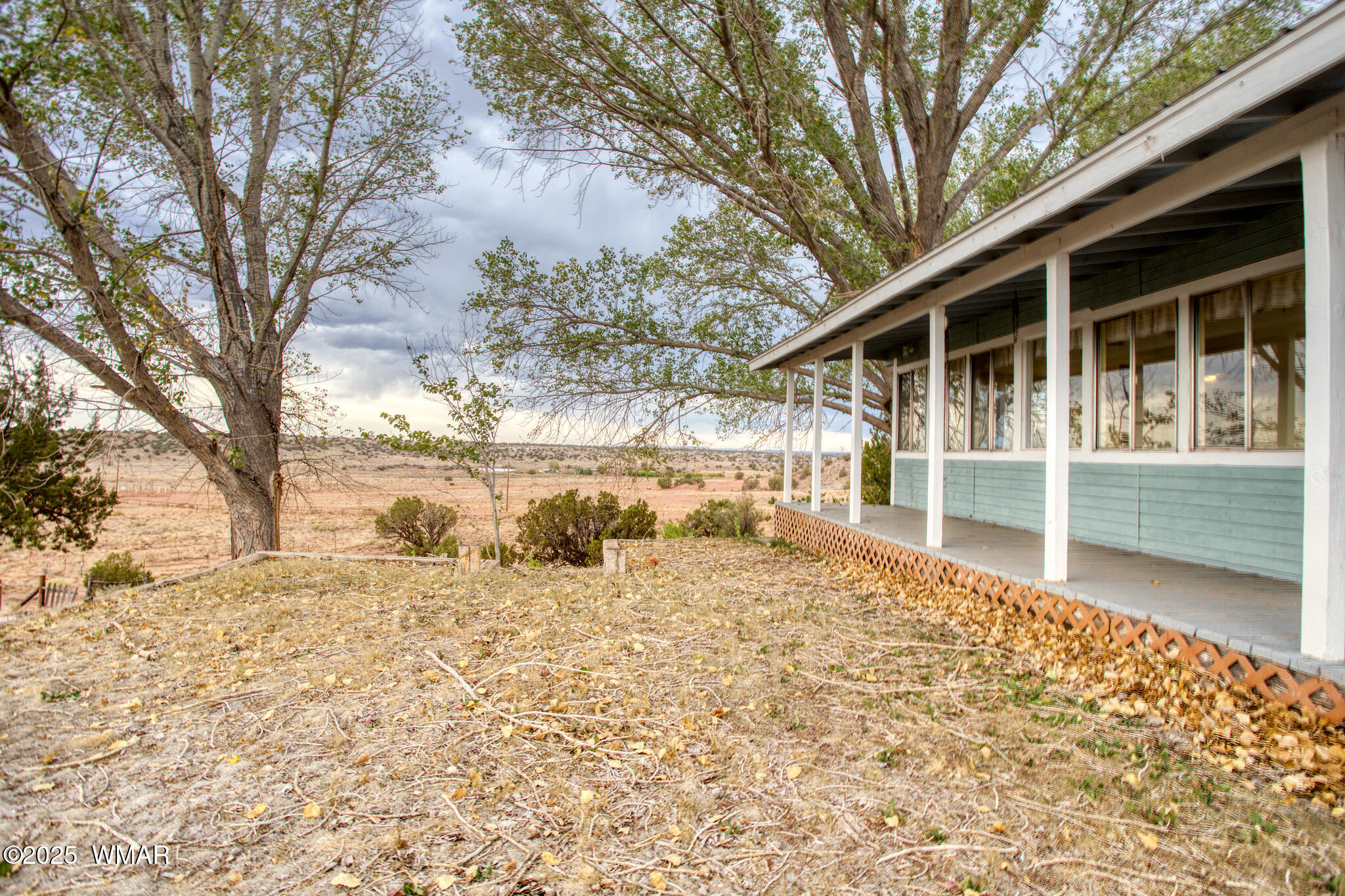 9410 Butler Trail Snowflake, AZ 85937 - Photo 7 of 62 a large white house with a large tree in front of it