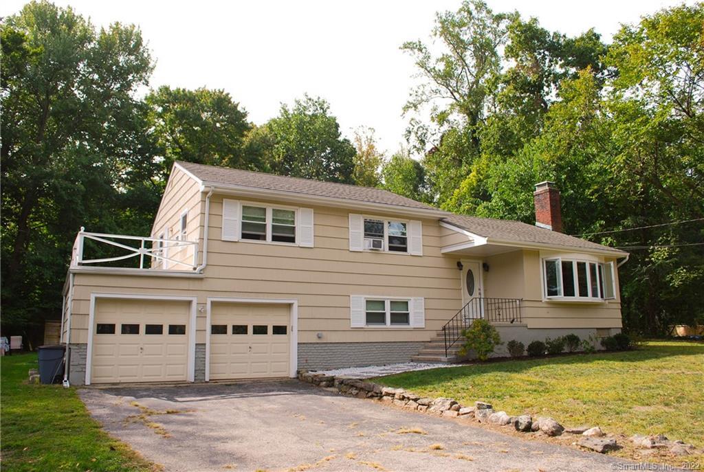 9 Jennifer Road Norwalk, CT 06850 - Photo 1 of 1 a view of a white house with a big yard and large trees