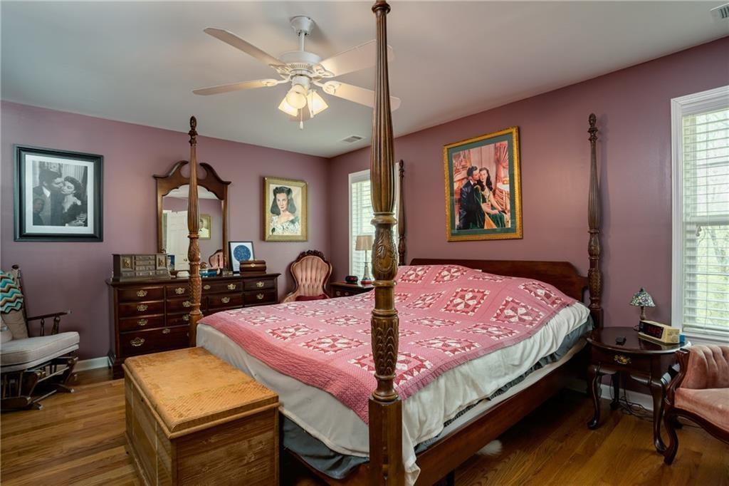 5160 Lakeview Parkway Villa Rica, GA 30180 - Photo 13 of 44 a bedroom with a bed a dresser and chair