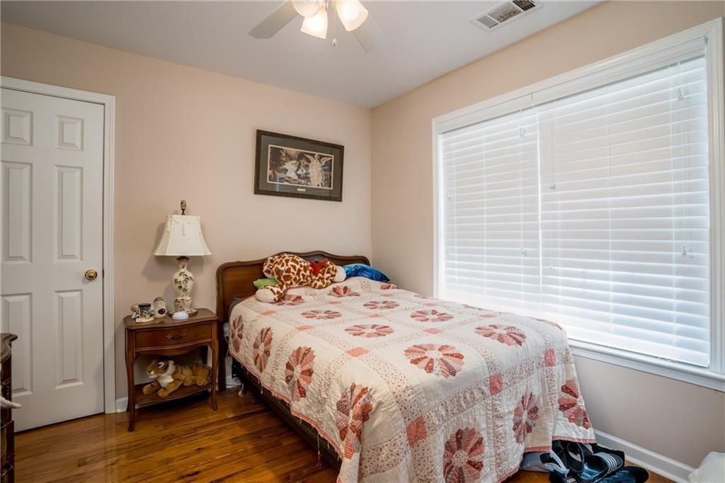 5160 Lakeview Parkway Villa Rica, GA 30180 - Photo 17 of 44 a bedroom with a bed and a window