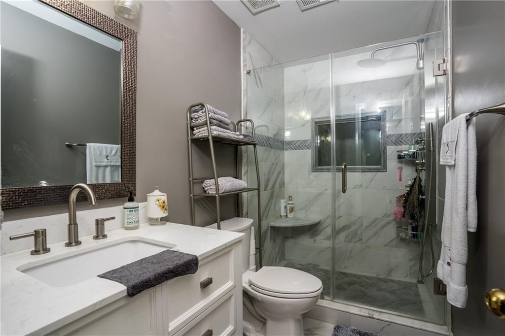 5160 Lakeview Parkway Villa Rica, GA 30180 - Photo 22 of 44 a bathroom with a sink toilet and shower