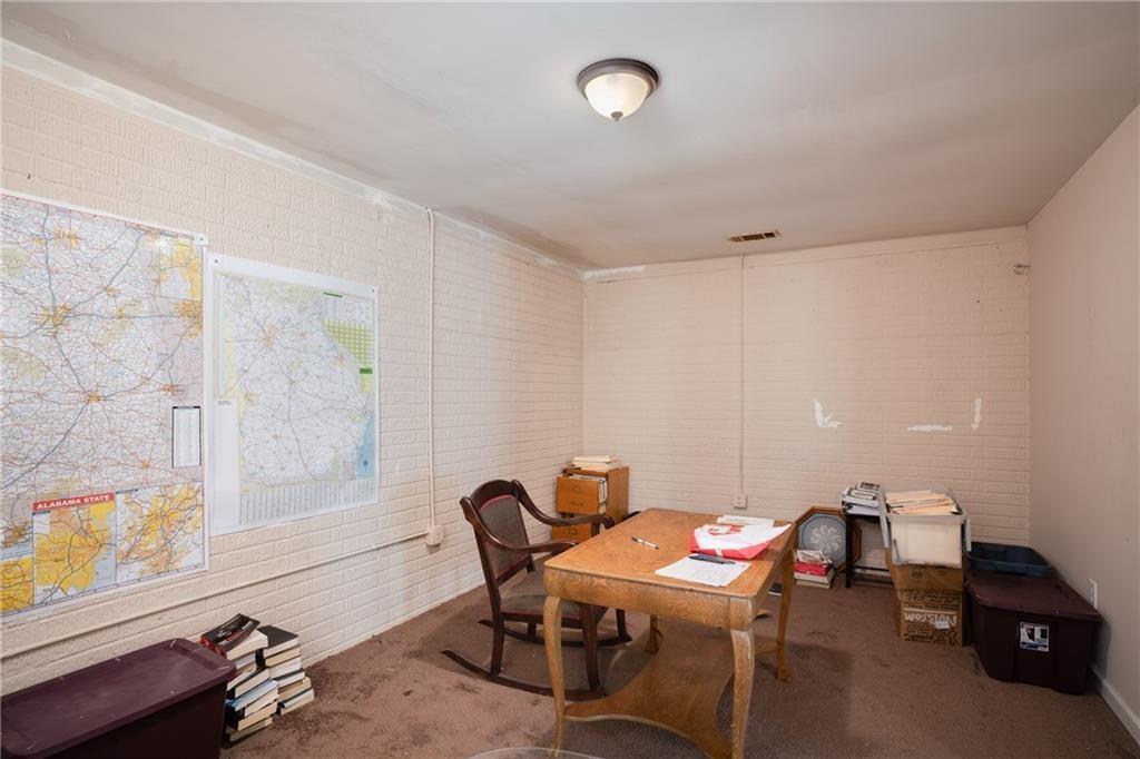 5160 Lakeview Parkway Villa Rica, GA 30180 - Photo 24 of 44 a room with a table and chairs