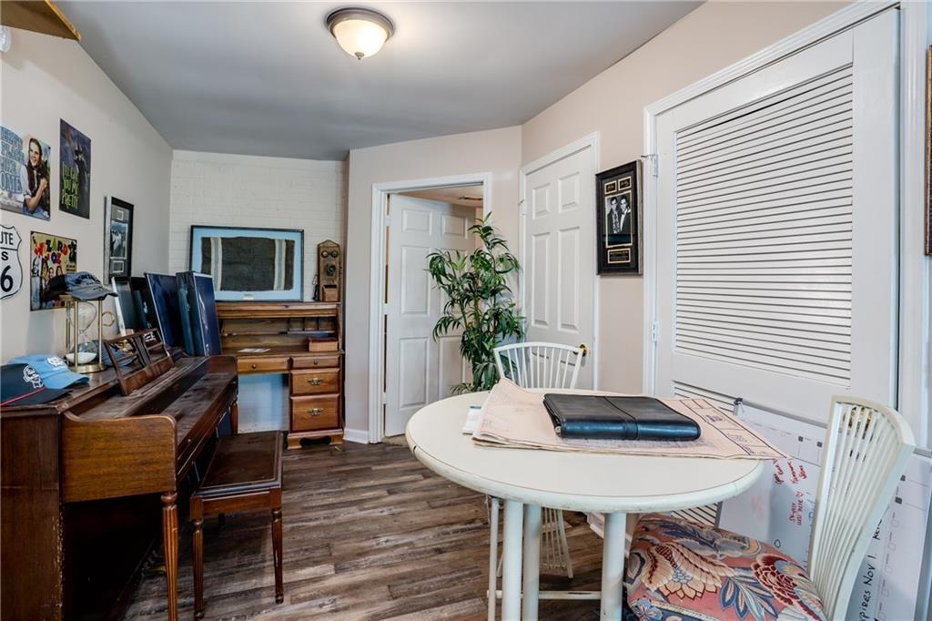 5160 Lakeview Parkway Villa Rica, GA 30180 - Photo 28 of 44 a view of a dining room with furniture and wooden floor