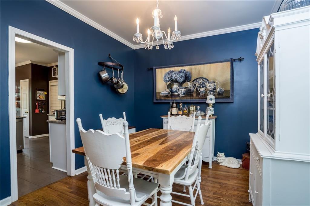 5160 Lakeview Parkway Villa Rica, GA 30180 - Photo 6 of 44 a dining room with furniture and chandelier