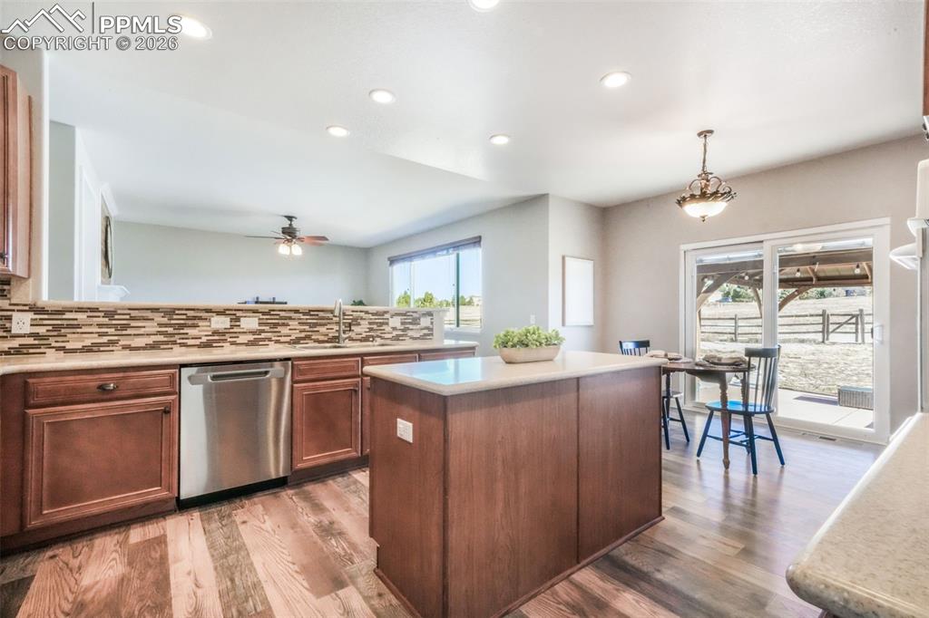 1675 Bowstring Road Monument, CO 80132 - Photo 12 of 50 a kitchen with lots of counter top space and dining table