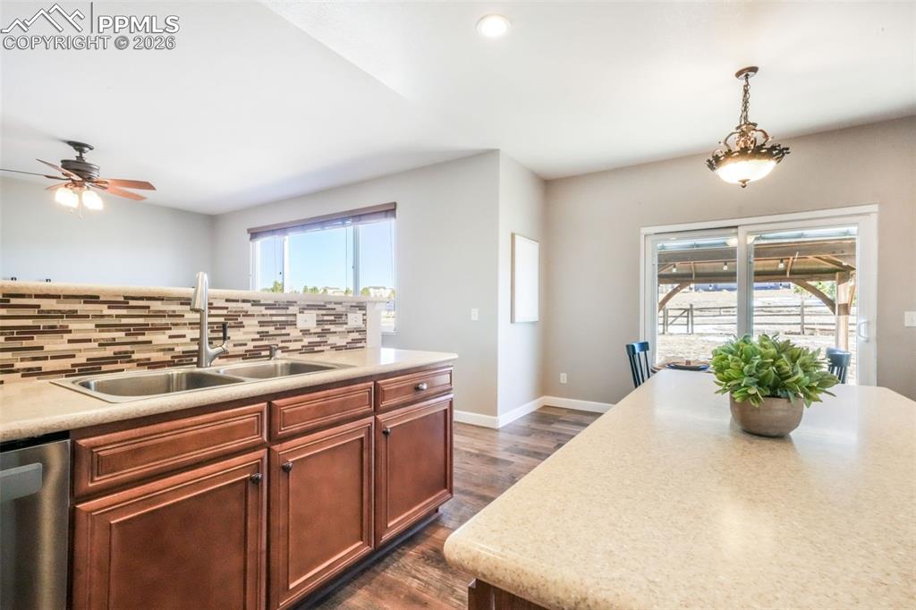 1675 Bowstring Road Monument, CO 80132 - Photo 13 of 50 a view of a kitchen and a chandelier