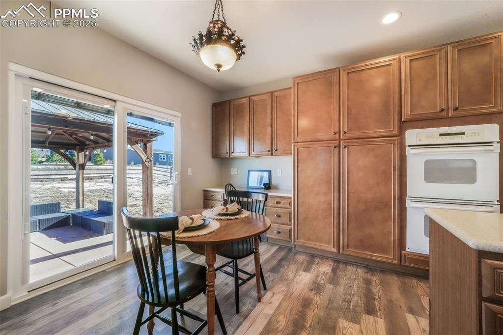 1675 Bowstring Road Monument, CO 80132 - Photo 15 of 50 a view of a dining room with furniture window and outside view