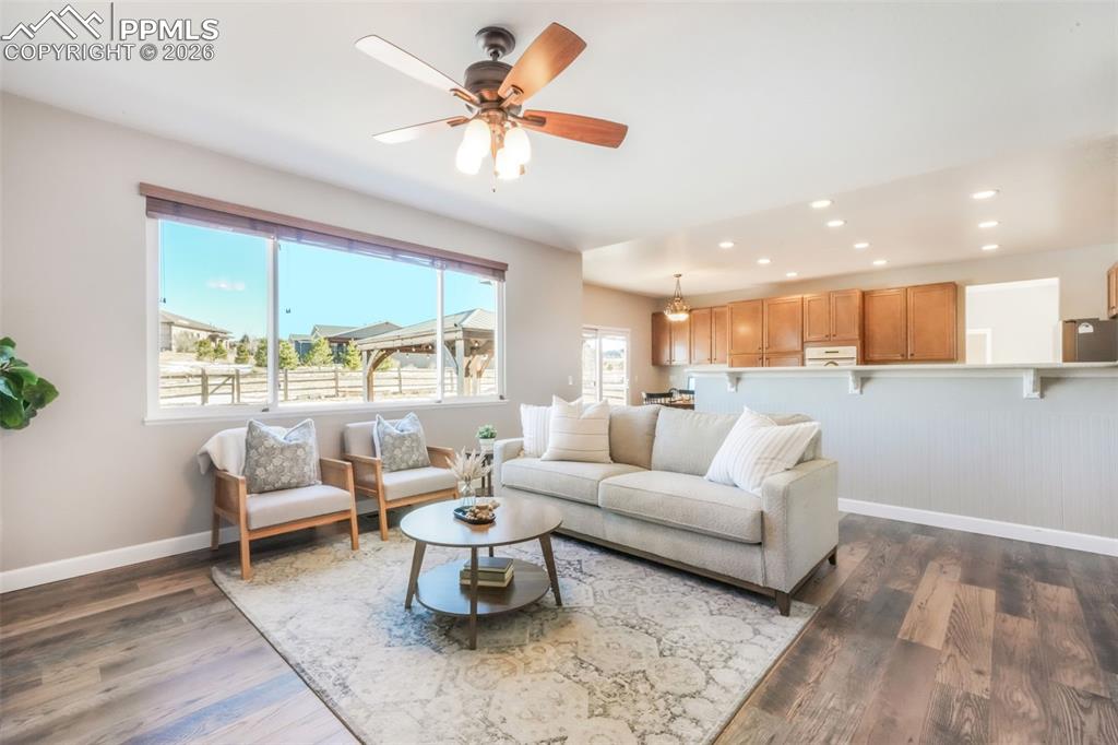 1675 Bowstring Road Monument, CO 80132 - Photo 21 of 50 a living room with furniture and a large window