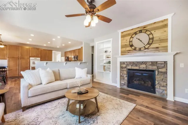 a living room with furniture and a fireplace