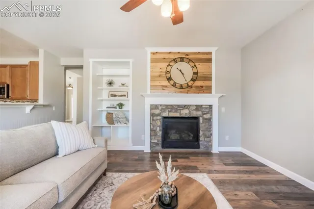 a living room with furniture and a fireplace