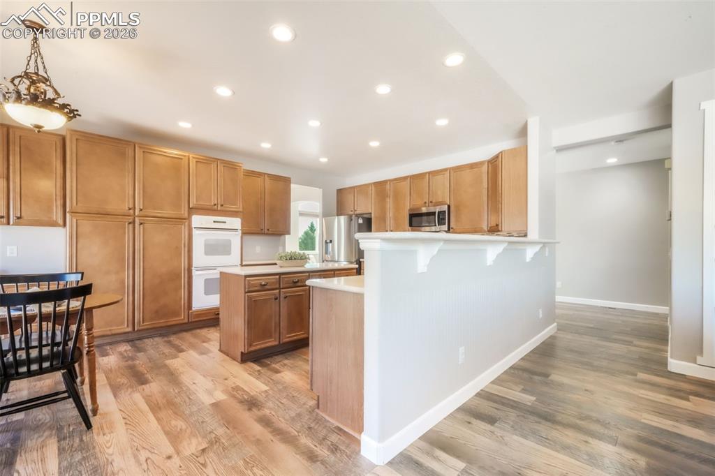 1675 Bowstring Road Monument, CO 80132 - Photo 24 of 50 a kitchen with a refrigerator and a sink