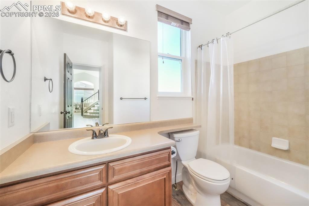 1675 Bowstring Road Monument, CO 80132 - Photo 26 of 50 a bathroom with a sink toilet a mirror and shower