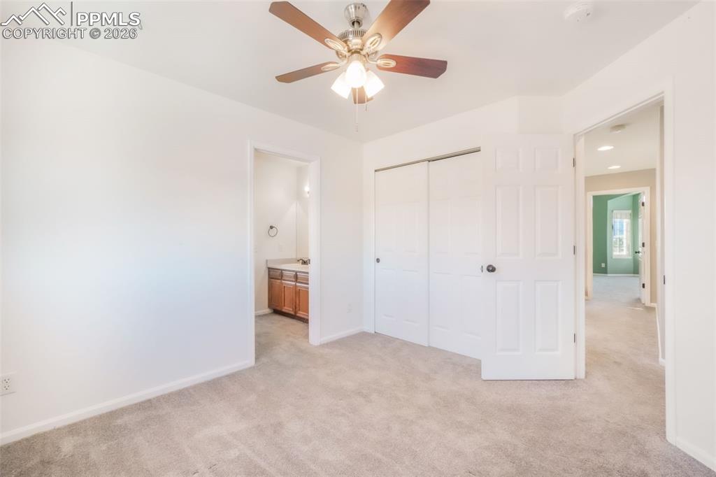 1675 Bowstring Road Monument, CO 80132 - Photo 29 of 50 an empty room with closet and fan
