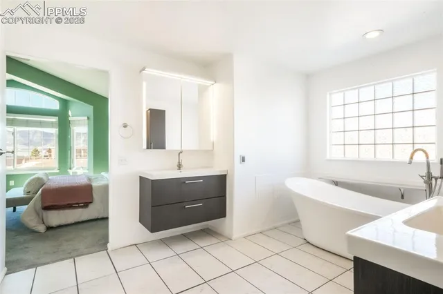 a bathroom with a bathtub and a sink