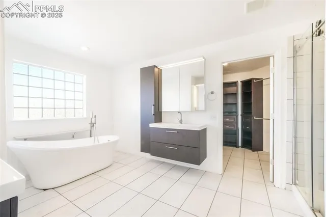 a bathroom with a double vanity sink and mirror