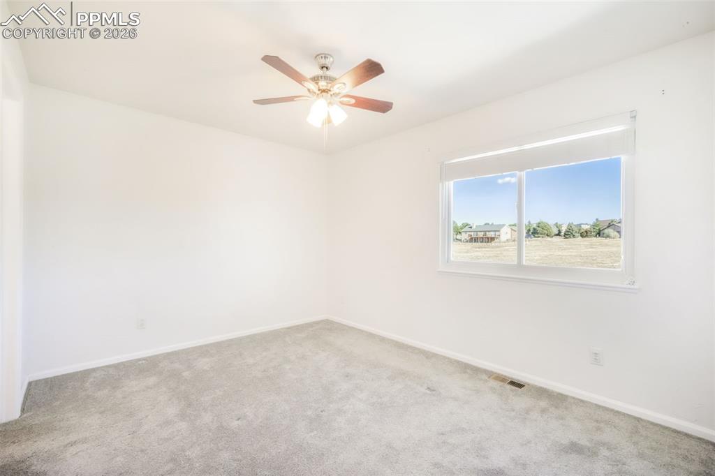 1675 Bowstring Road Monument, CO 80132 - Photo 44 of 50 an empty room with a window