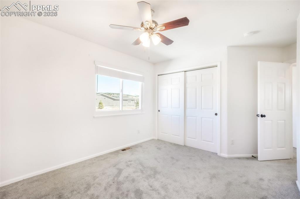 1675 Bowstring Road Monument, CO 80132 - Photo 46 of 50 a view of an empty room with a window