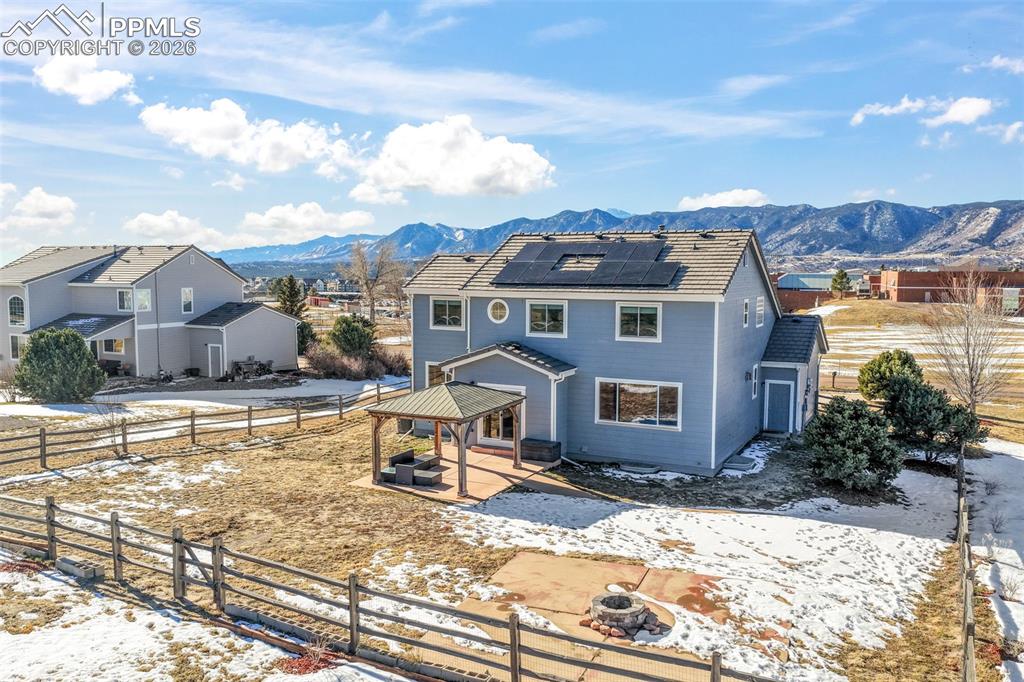 1675 Bowstring Road Monument, CO 80132 - Photo 49 of 50 a front view of a house with a yard