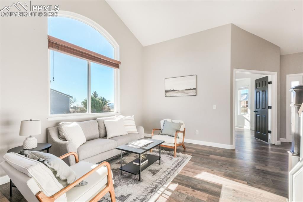 1675 Bowstring Road Monument, CO 80132 - Photo 7 of 50 a living room with furniture and a large window