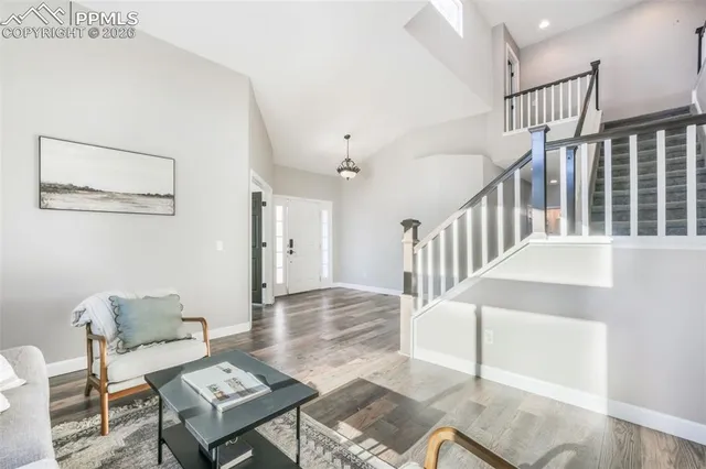 a view of a livingroom with furniture and wooden floor