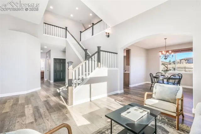 a living room with furniture and a table