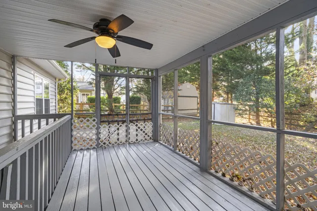 a view of a porch with wooden floor