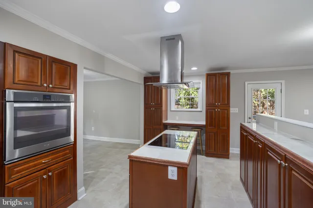 a kitchen view with granite countertop a stove and a refrigerator