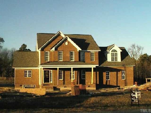 1033 Bellewood Farms Road Raleigh, NC 27603 - Photo 1 of 1 a front view of a house with a yard