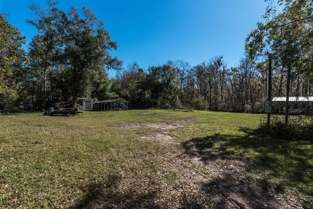 a view of outdoor space with deck and yard