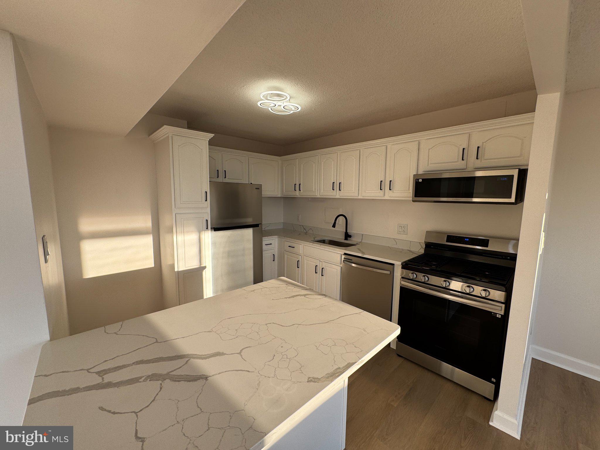 1836 Metzerott Road, Unit 1722 Hyattsville, MD 20783 - Photo 1 of 17 Modern kitchen with sleek finishes.