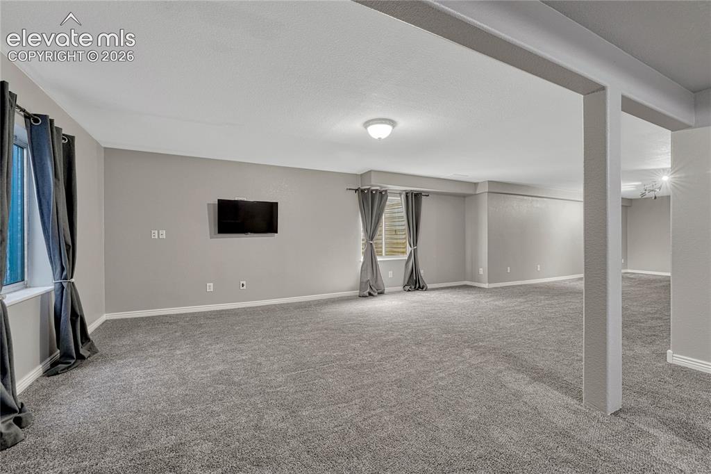 13695 Woodlake Road Elbert, CO 80106 - Photo 28 of 39 Large carpeted family and recreation room.