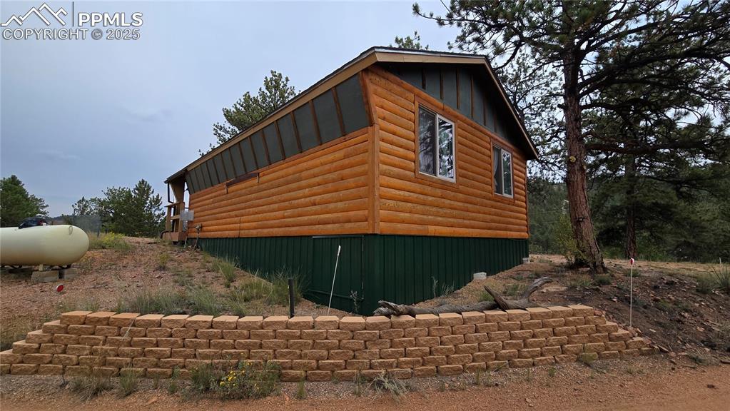 259 Vermillion Road Lake George, CO 80827 - Photo 19 of 46 a front view of a house with a yard