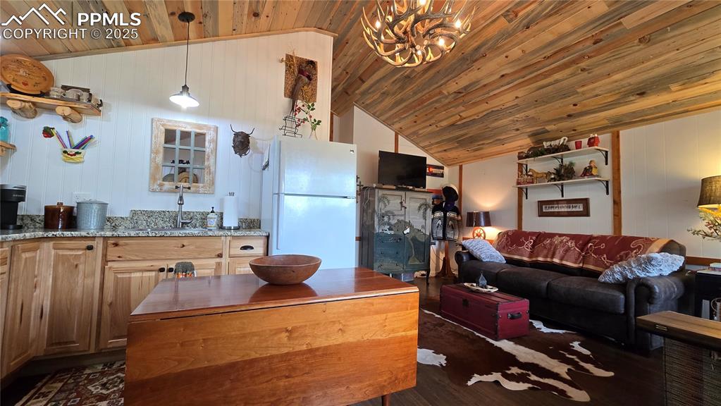 259 Vermillion Road Lake George, CO 80827 - Photo 26 of 46 a living room with furniture and a flat screen tv