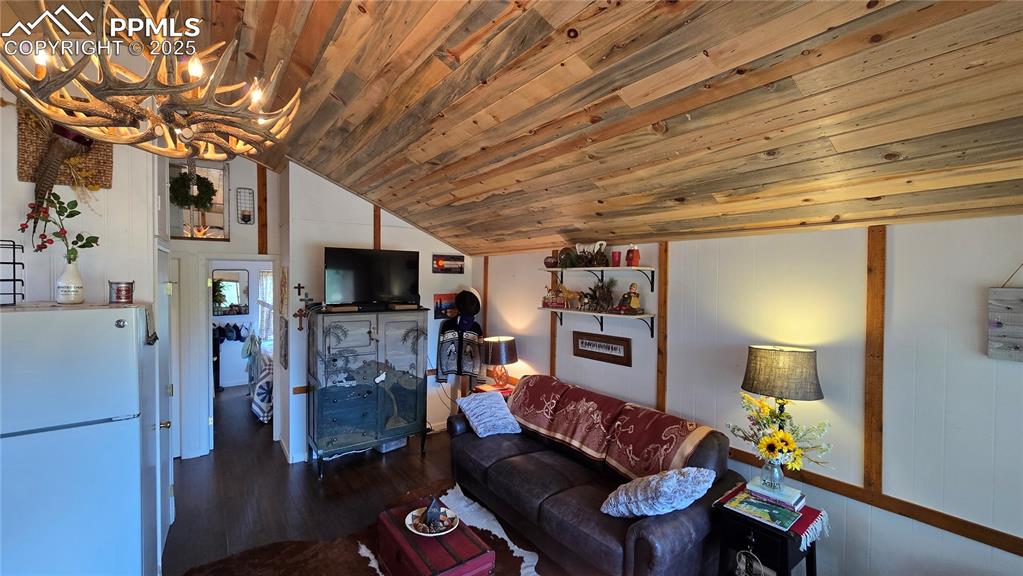 259 Vermillion Road Lake George, CO 80827 - Photo 42 of 46 a living room with furniture and a flat screen tv