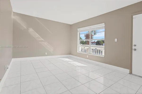 a view of an empty room with a window