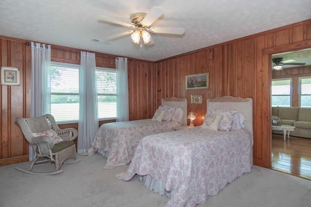 193 Padgetts Road Seale, AL 36875 - Photo 17 of 49 a bedroom with a bed and a chandelier