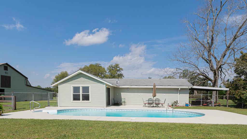 193 Padgetts Road Seale, AL 36875 - Photo 18 of 49 a front view of a house with a yard