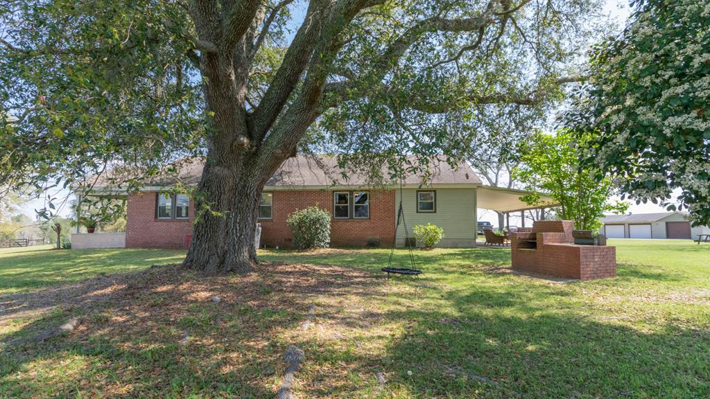 193 Padgetts Road Seale, AL 36875 - Photo 41 of 49 a backyard of a house with oven and garden