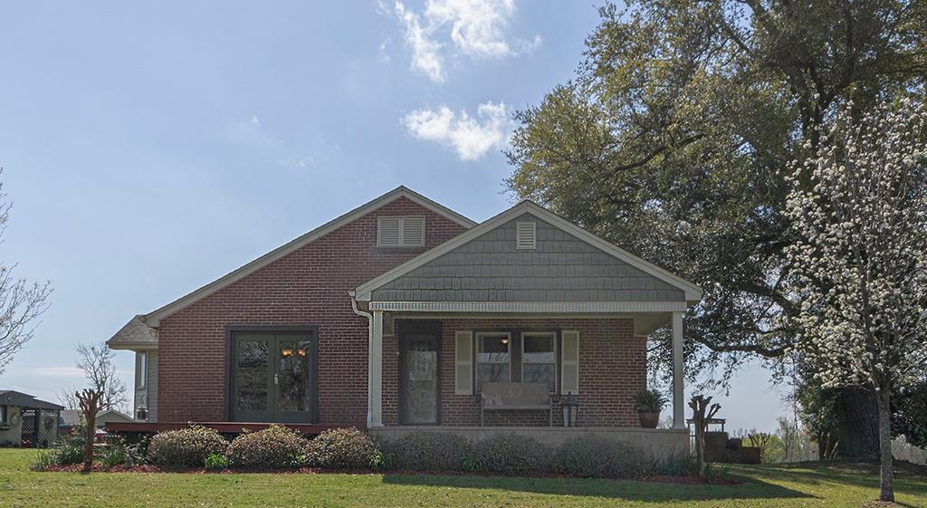 193 Padgetts Road Seale, AL 36875 - Photo 45 of 49 a front view of a house with a garden