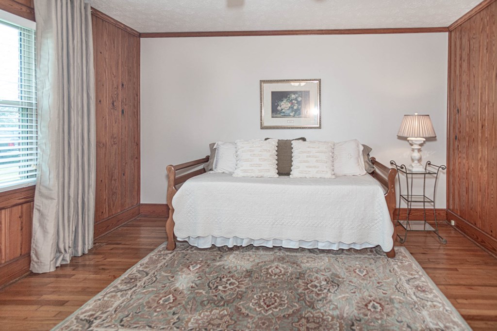193 Padgetts Road Seale, AL 36875 - Photo 8 of 49 a large bed sitting in a bedroom next to a window