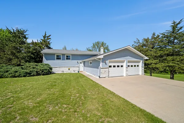 front view of a house with a yard