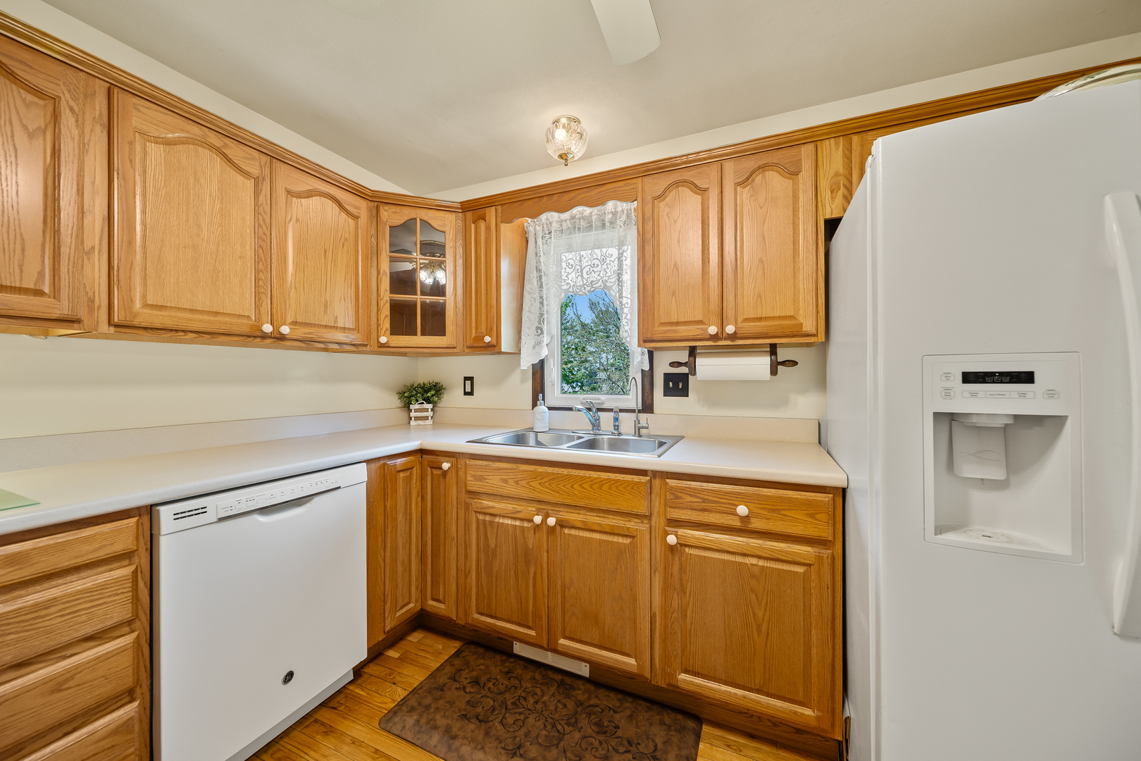 24146 Stage Coach Road Geneseo, IL 61254 - Photo 11 of 39 a kitchen with a sink cabinets and window