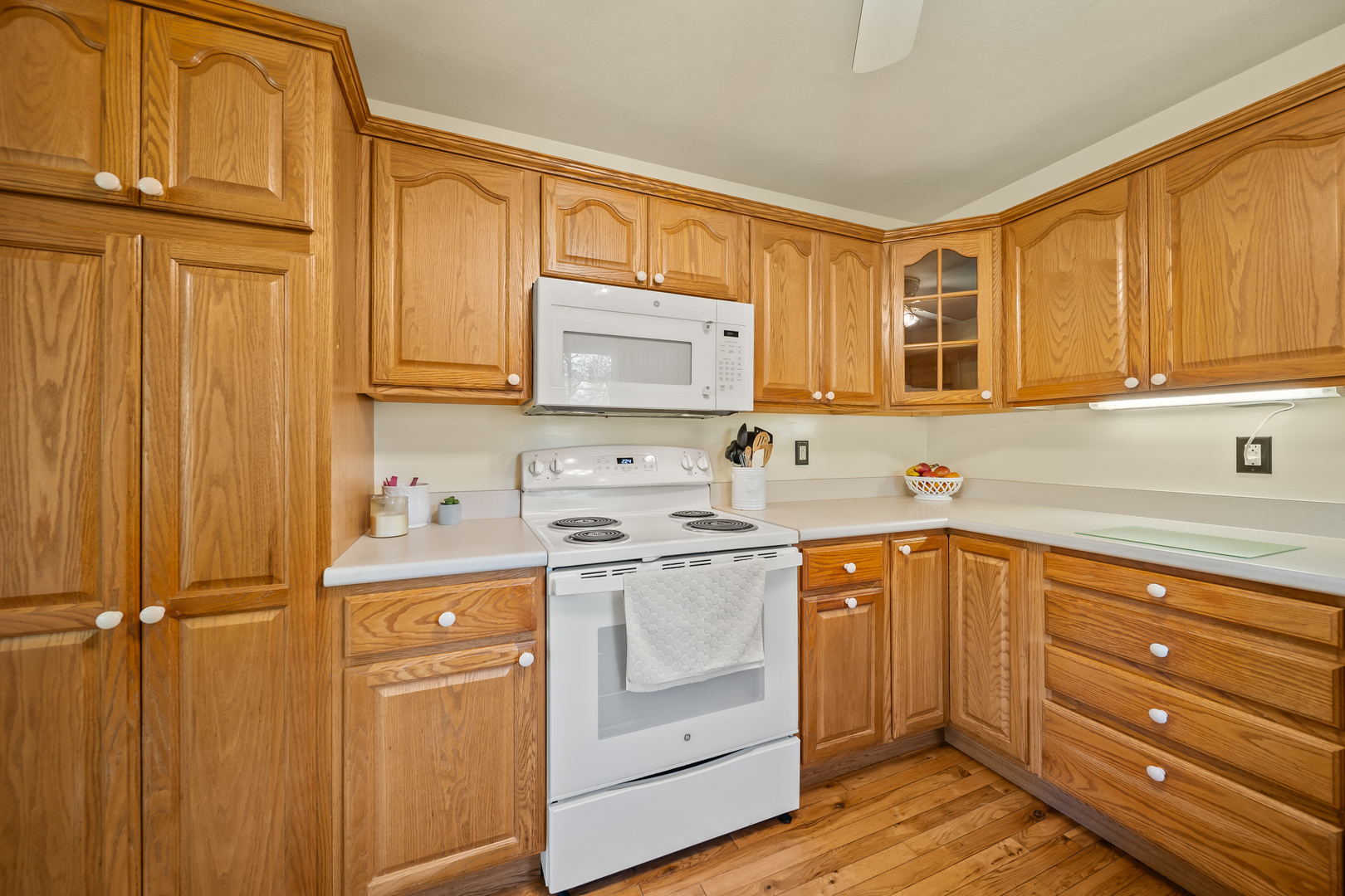 24146 Stage Coach Road Geneseo, IL 61254 - Photo 12 of 39 a kitchen with stainless steel appliances granite countertop a sink stove and cabinets