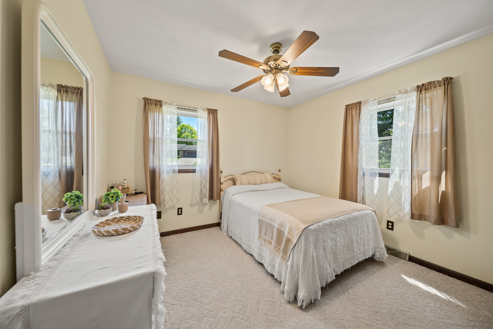 24146 Stage Coach Road Geneseo, IL 61254 - Photo 13 of 39 a bedroom with a large bed and a chandelier