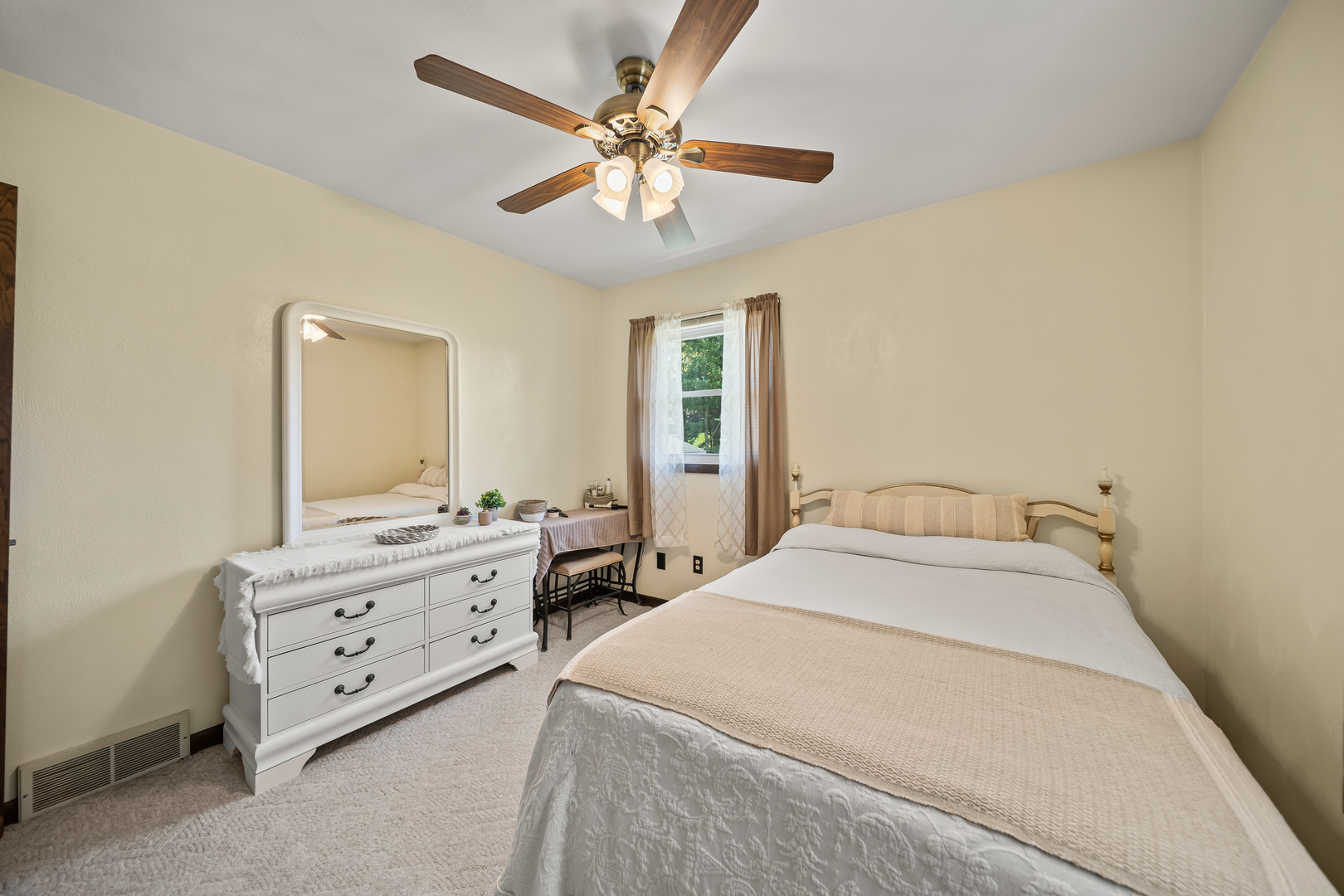 24146 Stage Coach Road Geneseo, IL 61254 - Photo 14 of 39 a spacious bedroom with a bed and a chandelier