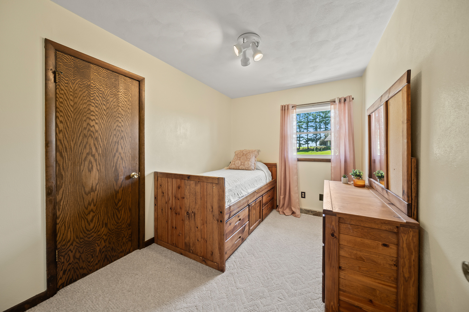 24146 Stage Coach Road Geneseo, IL 61254 - Photo 16 of 39 a room with a bed and a dresser