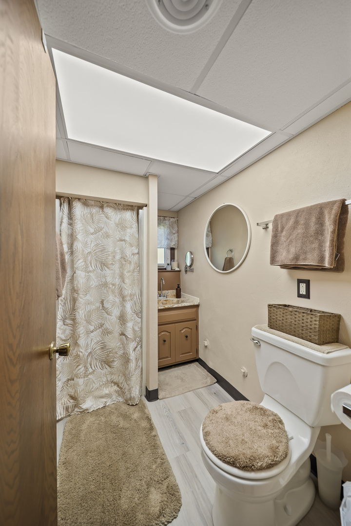 24146 Stage Coach Road Geneseo, IL 61254 - Photo 23 of 39 a bathroom with a granite countertop sink mirror vanity and toilet