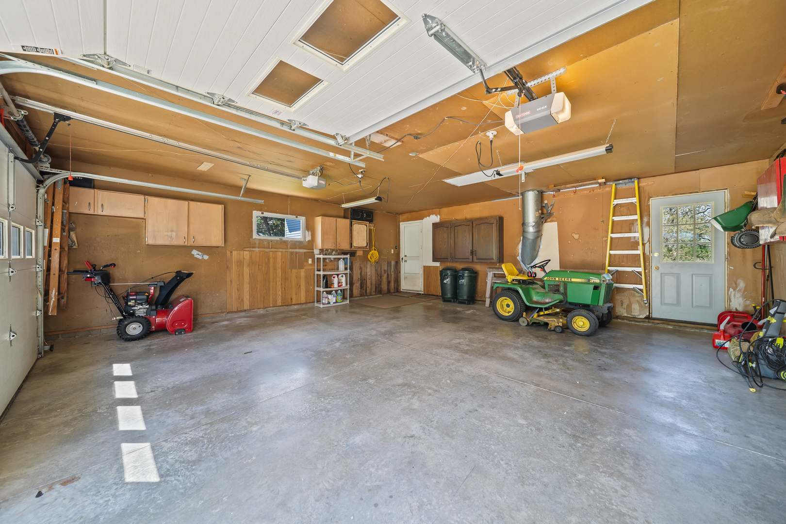 24146 Stage Coach Road Geneseo, IL 61254 - Photo 27 of 39 a view of a garage with a table and chairs