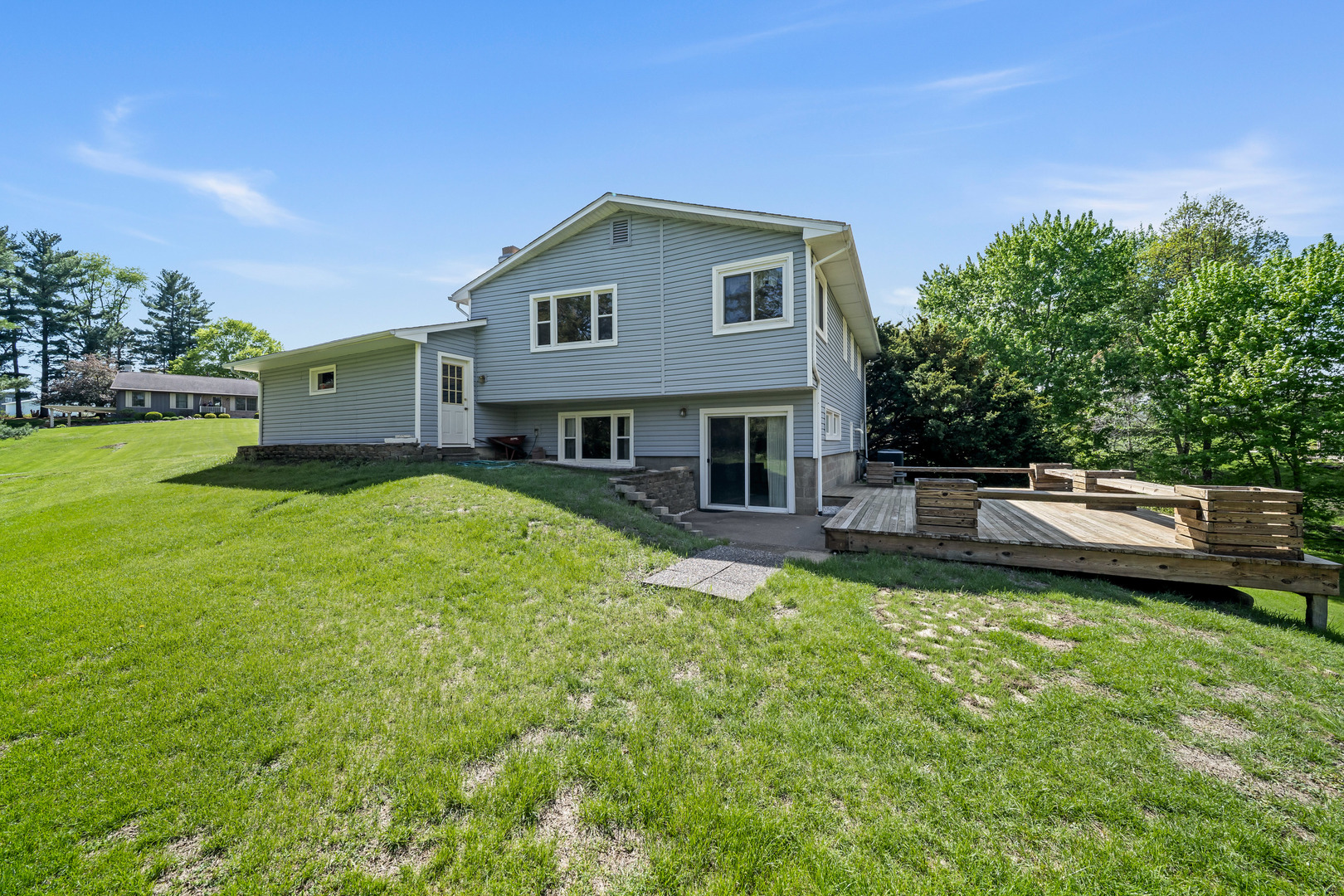 24146 Stage Coach Road Geneseo, IL 61254 - Photo 29 of 39 a view of a house with a yard porch and sitting area